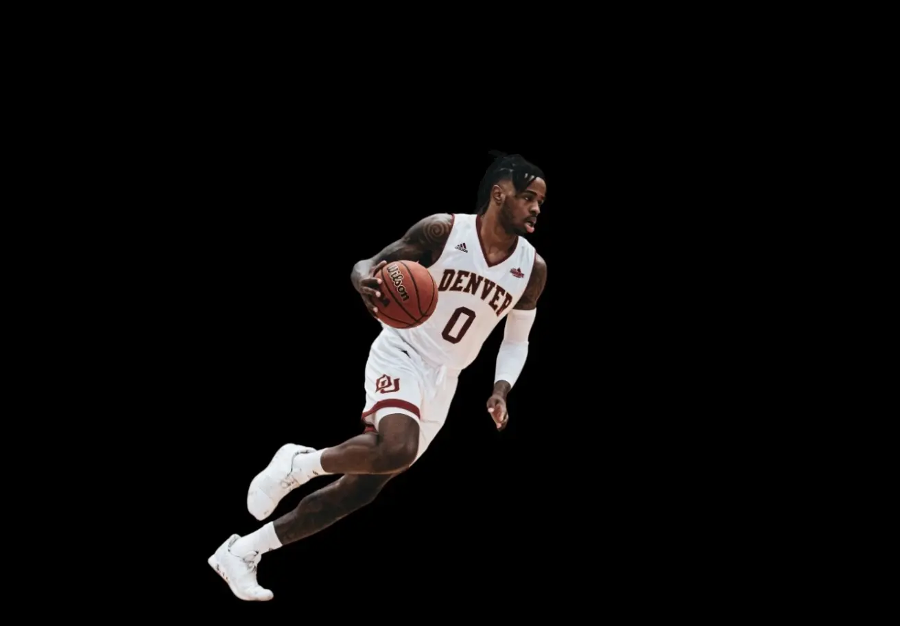 A basketball player running with a basketball