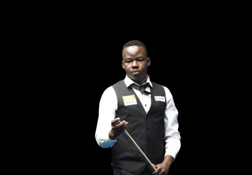 Pool player Ceaser Chadinga holding his cue during a pool game