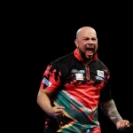 African darts legend Devon Petersen celebrating a darts match