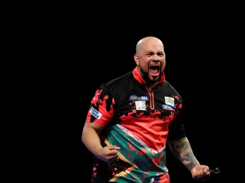 African darts legend Devon Petersen celebrating a darts match