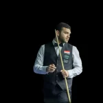 Snooker player Mahmoud El Hareedy eyeing up his next shot in a snooker match